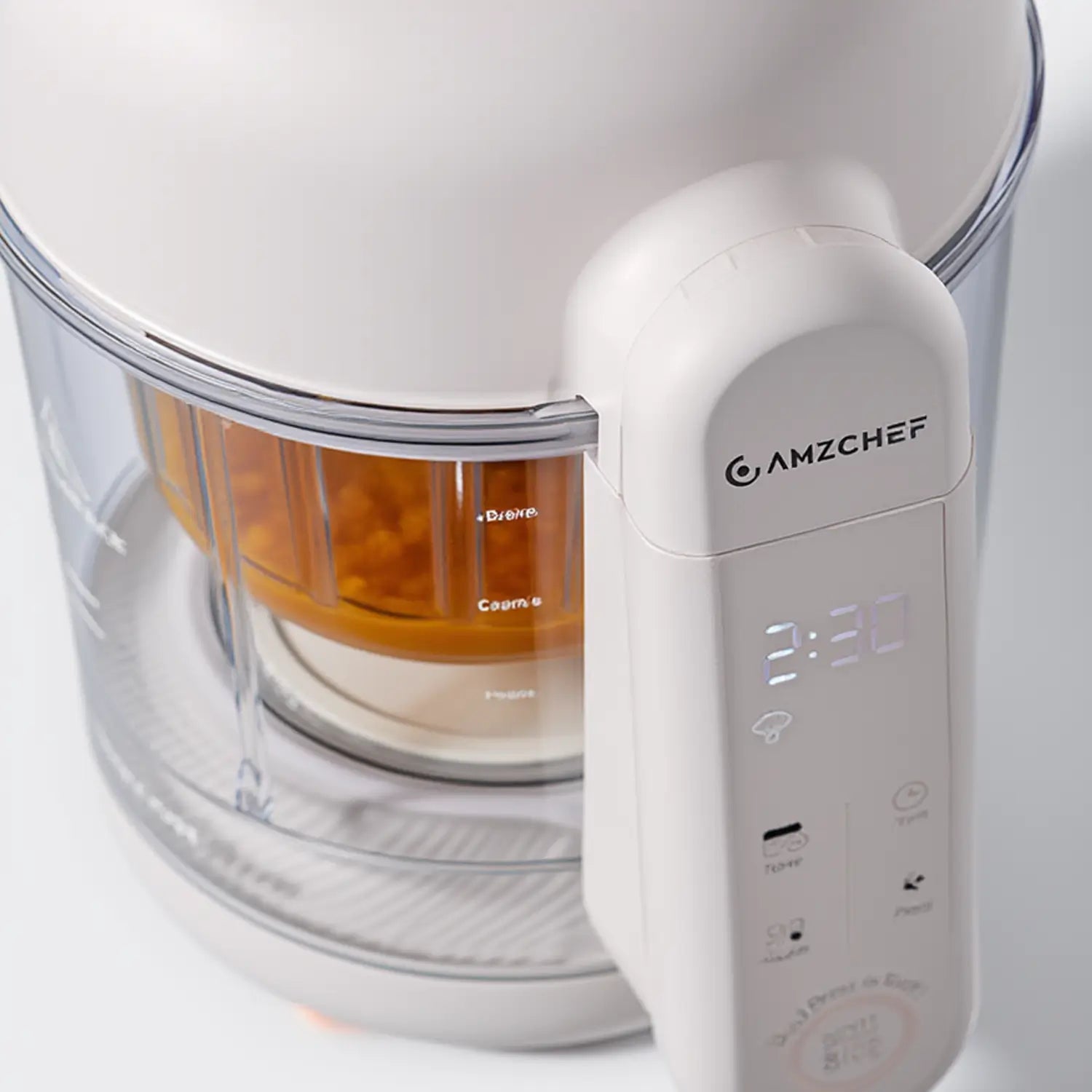 White kitchen appliance with digital display and clear container on a white background